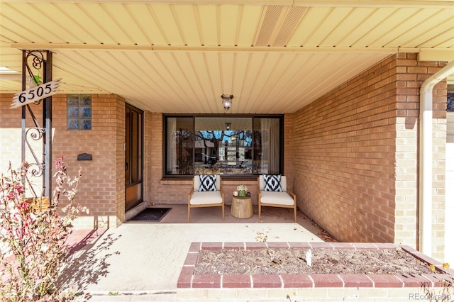 entrance to property with brick siding