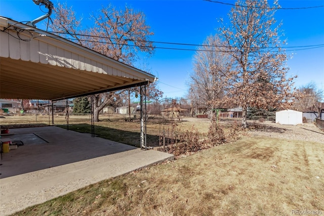 view of yard featuring a shed and an outbuilding