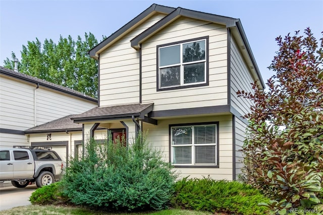545 Tanager St, Brighton, CO 80601 - view of front of home with a garage and a shingled roof