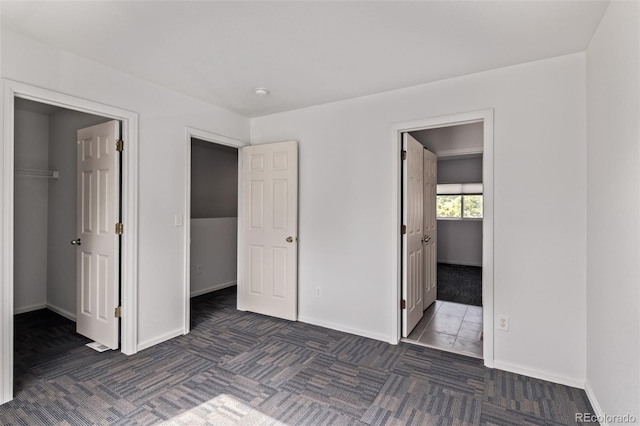 545 Tanager St, Brighton, CO 80601 - unfurnished bedroom with a walk in closet and carpet