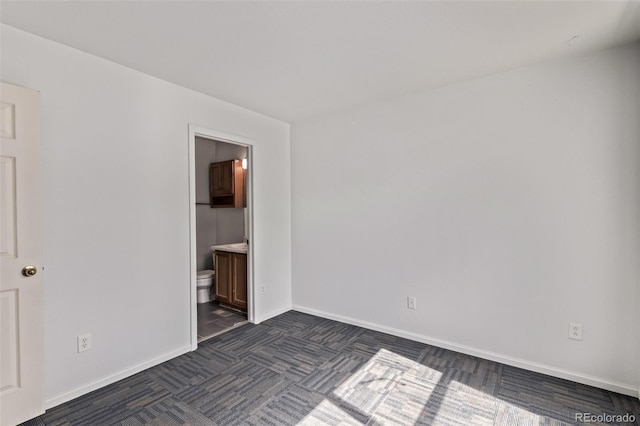 545 Tanager St, Brighton, CO 80601 - unfurnished bedroom with baseboards and ensuite bath