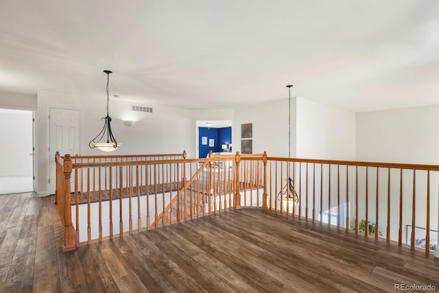 hall with dark hardwood / wood-style flooring