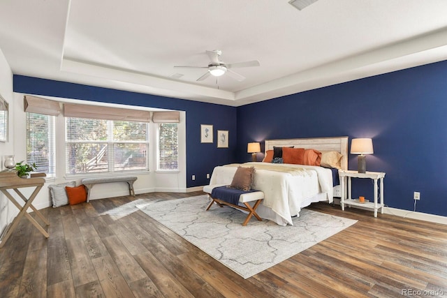 bedroom featuring ceiling fan and dark hardwood / wood-style flooring