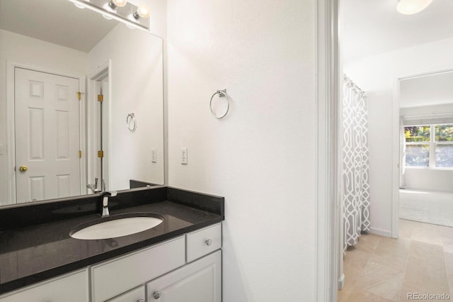 bathroom featuring vanity and tile patterned flooring