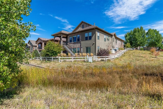 10731 Featherwalk Ln, Highlands Ranch, CO 80126 - back of property featuring fence and stairs