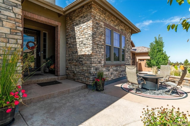 10731 Featherwalk Ln, Highlands Ranch, CO 80126 - view of patio / terrace featuring an outdoor fire pit