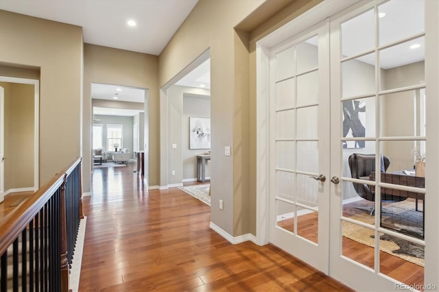 10731 Featherwalk Ln, Highlands Ranch, CO 80126 - hall featuring wood finished floors, french doors, recessed lighting, and baseboards