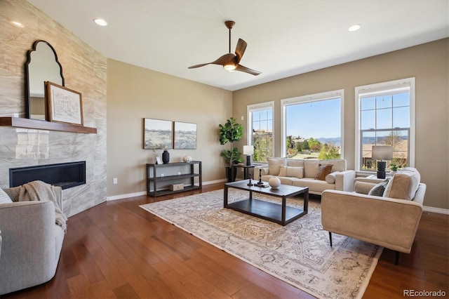 10731 Featherwalk Ln, Highlands Ranch, CO 80126 - living room with a ceiling fan, recessed lighting, baseboards, dark wood-style flooring, and a high end fireplace