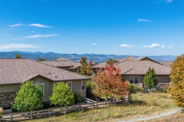 10731 Featherwalk Ln, Highlands Ranch, CO 80126 - single story home with a mountain view, stucco siding, a tile roof, and fence