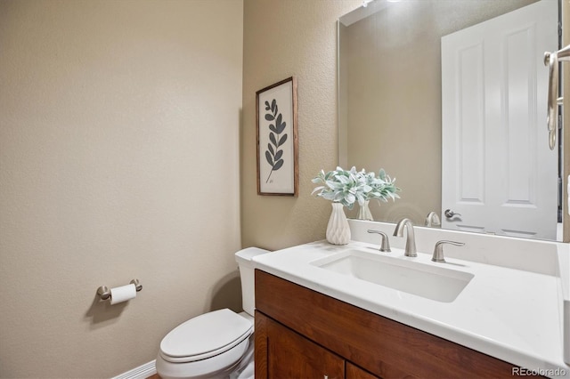 10731 Featherwalk Ln, Highlands Ranch, CO 80126 - half bath with toilet, vanity, and a textured wall