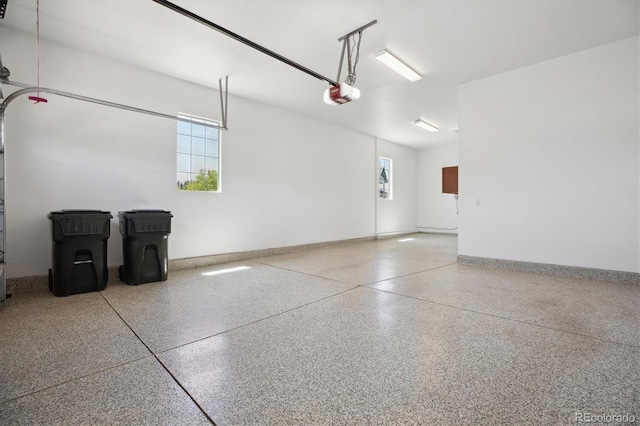 10731 Featherwalk Ln, Highlands Ranch, CO 80126 - garage with a garage door opener and baseboards
