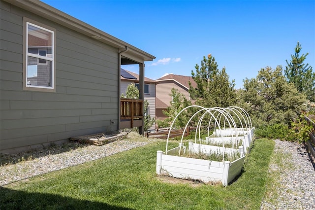 12210 Pine Post Dr, Parker, CO 80138 - view of green lawn featuring a vegetable garden