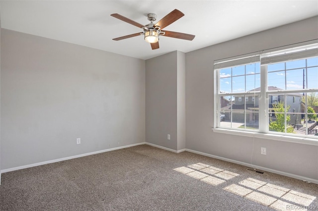 12210 Pine Post Dr, Parker, CO 80138 - empty room with plenty of natural light, a ceiling fan, carpet flooring, and baseboards