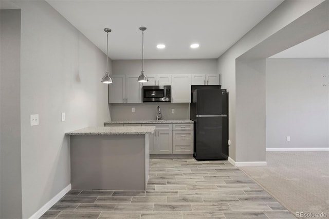 12210 Pine Post Dr, Parker, CO 80138 - kitchen featuring freestanding refrigerator, stainless steel microwave, a sink, baseboards, and recessed lighting