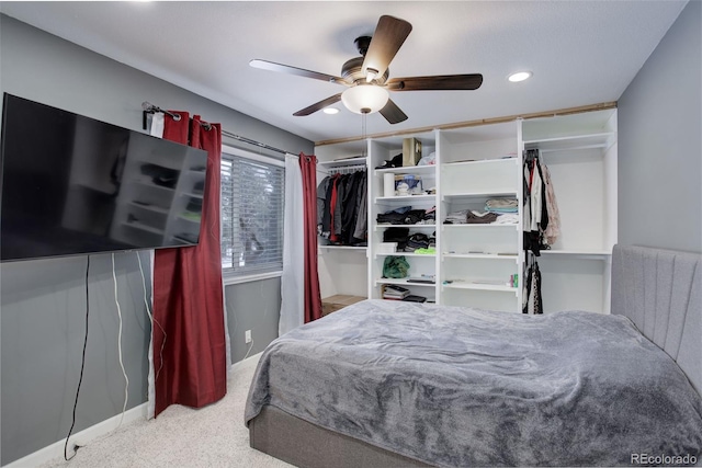 carpeted bedroom featuring a ceiling fan and recessed lighting