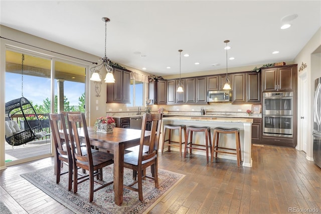 dining area with dark wood-style flooring
