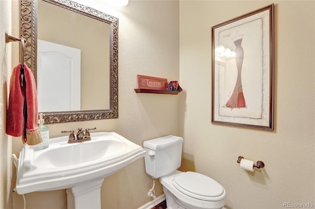 bathroom with a sink and toilet