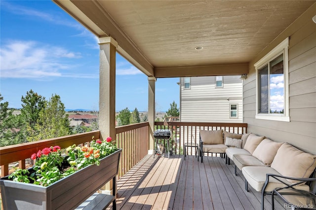 wooden deck featuring an outdoor living space