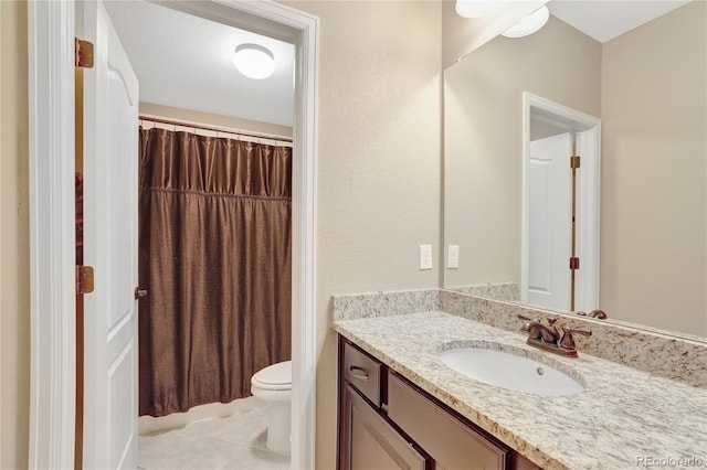 bathroom with toilet, a shower with curtain, tile patterned flooring, and vanity