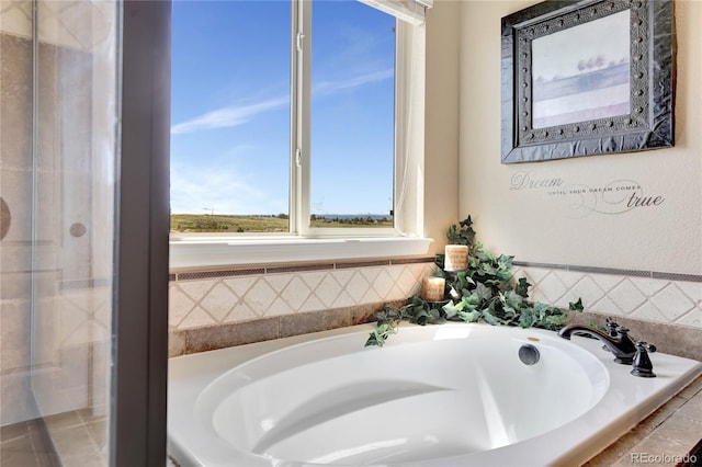 bathroom with a garden tub and an enclosed shower