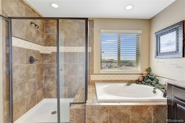 bathroom with vanity, a bath, a stall shower, and recessed lighting