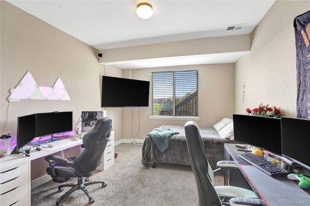 home office with baseboards, visible vents, and light carpet