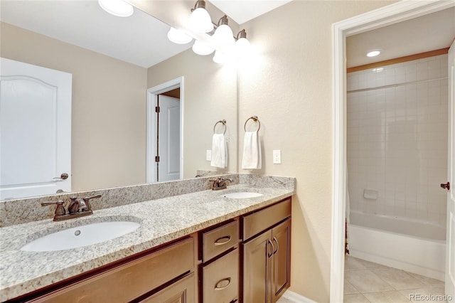 bathroom featuring tile patterned flooring, a sink, baseboards, and double vanity