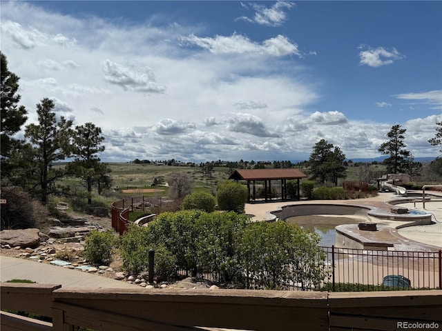 view of property's community featuring a gazebo and fence