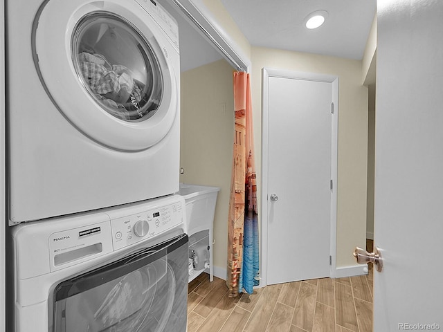 5319 E Davies Dr, Centennial, CO 80122 - washroom with stacked washer / dryer, wood finish floors, and recessed lighting