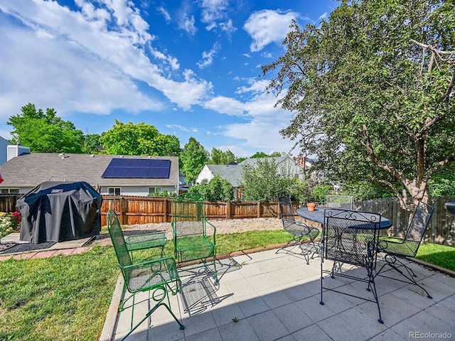5319 E Davies Dr, Centennial, CO 80122 - fenced backyard with a patio area, outdoor dining area, and a grill