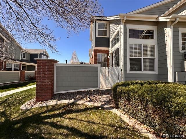 view of home's exterior with a lawn