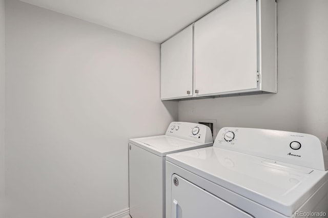 laundry area with cabinets and washer and dryer