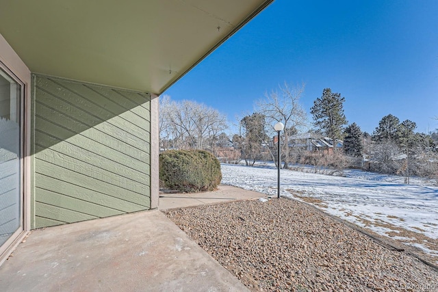 view of yard covered in snow