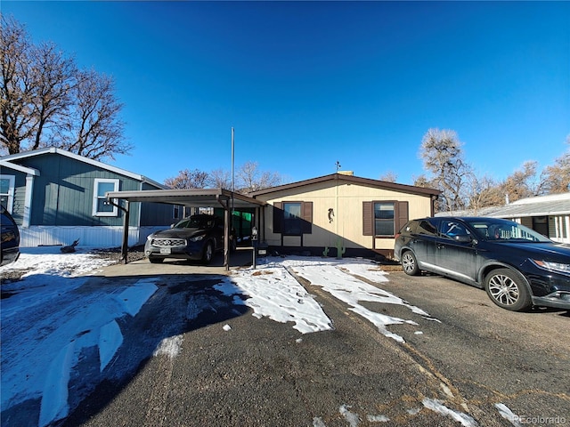 view of front facade with a carport