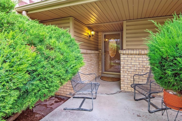 entrance to property featuring a patio