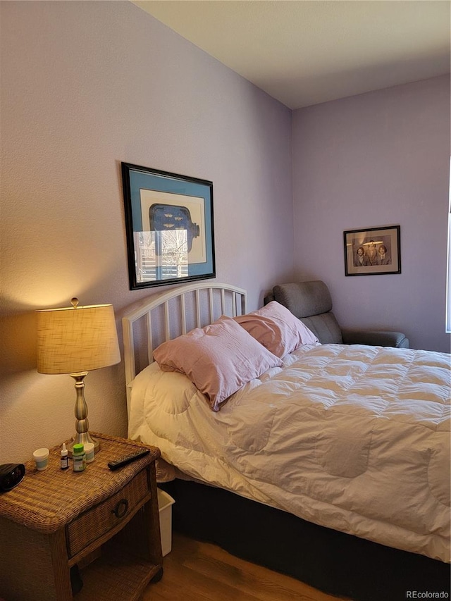 bedroom with wood finished floors