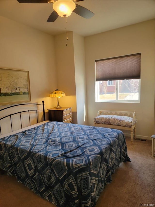 bedroom featuring carpet, ceiling fan, and baseboards