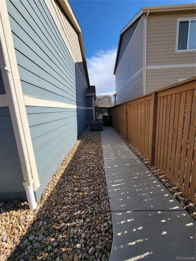 view of home's exterior featuring fence