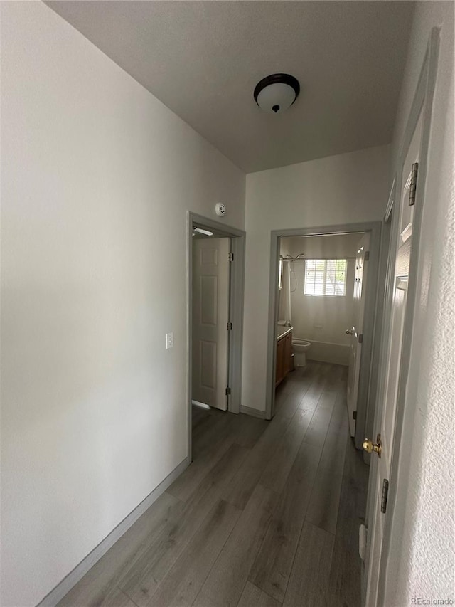 12235 E 2nd Dr, Aurora, CO 80011 - corridor featuring dark wood-style floors