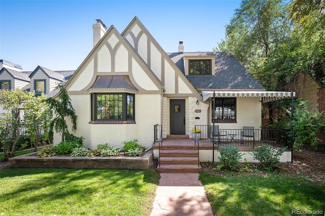 tudor house with a front yard