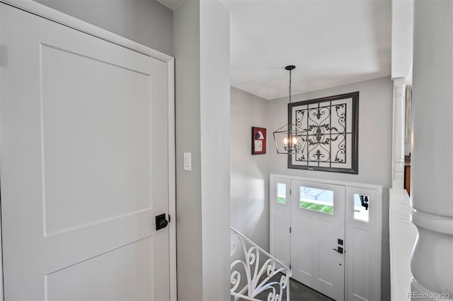 1733 S Urban Way, Lakewood, CO 80228 - entrance foyer featuring a chandelier