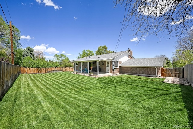 1733 S Urban Way, Lakewood, CO 80228 - view of yard with a patio area