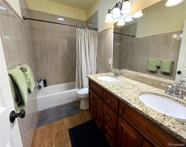 full bathroom featuring vanity, shower / bath combo, and toilet