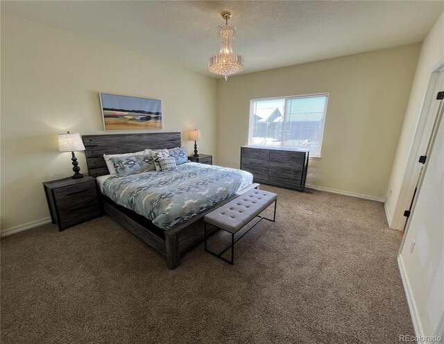 carpeted bedroom with an inviting chandelier