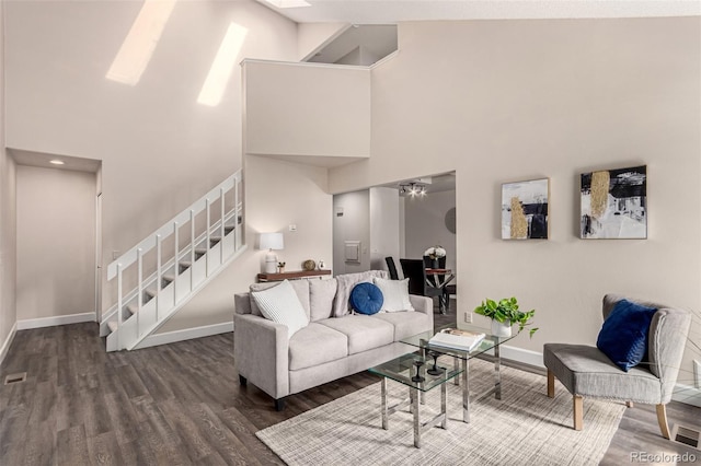 3049 E Long Cir S, Centennial, CO 80122 - living room featuring a high ceiling, stairs, wood finished floors, and a ceiling fan