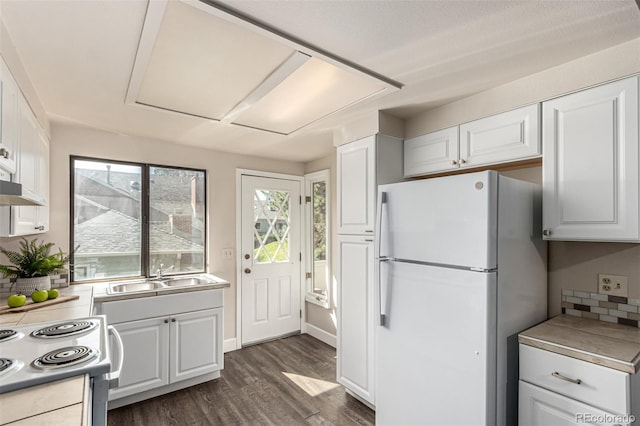 3049 E Long Cir S, Centennial, CO 80122 - kitchen with white appliances, dark wood finished floors, white cabinets, and healthy amount of natural light