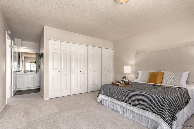 3049 E Long Cir S, Centennial, CO 80122 - bedroom featuring carpet, a closet, and a textured ceiling