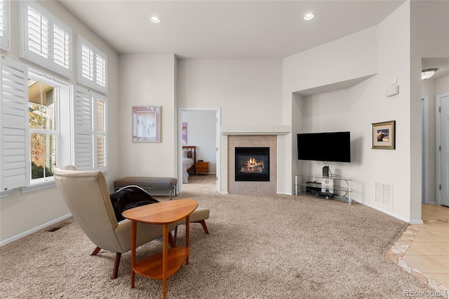 living area with plenty of natural light, recessed lighting, visible vents, and baseboards