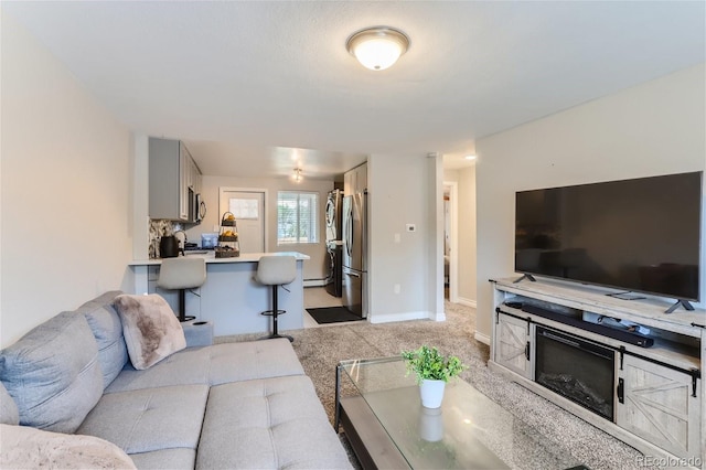 living room featuring light colored carpet