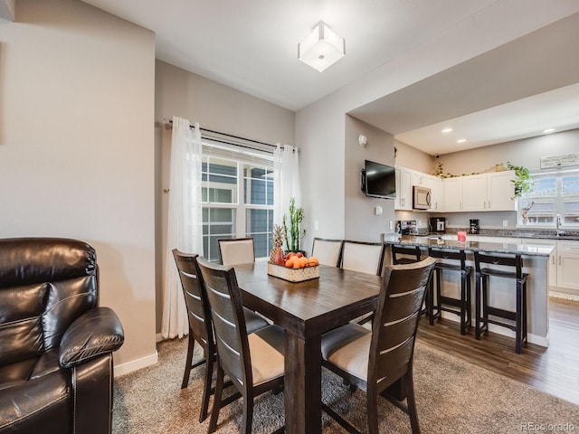 246 Ash St, Bennett, CO 80102 - dining area featuring dark wood finished floors, baseboards, and recessed lighting